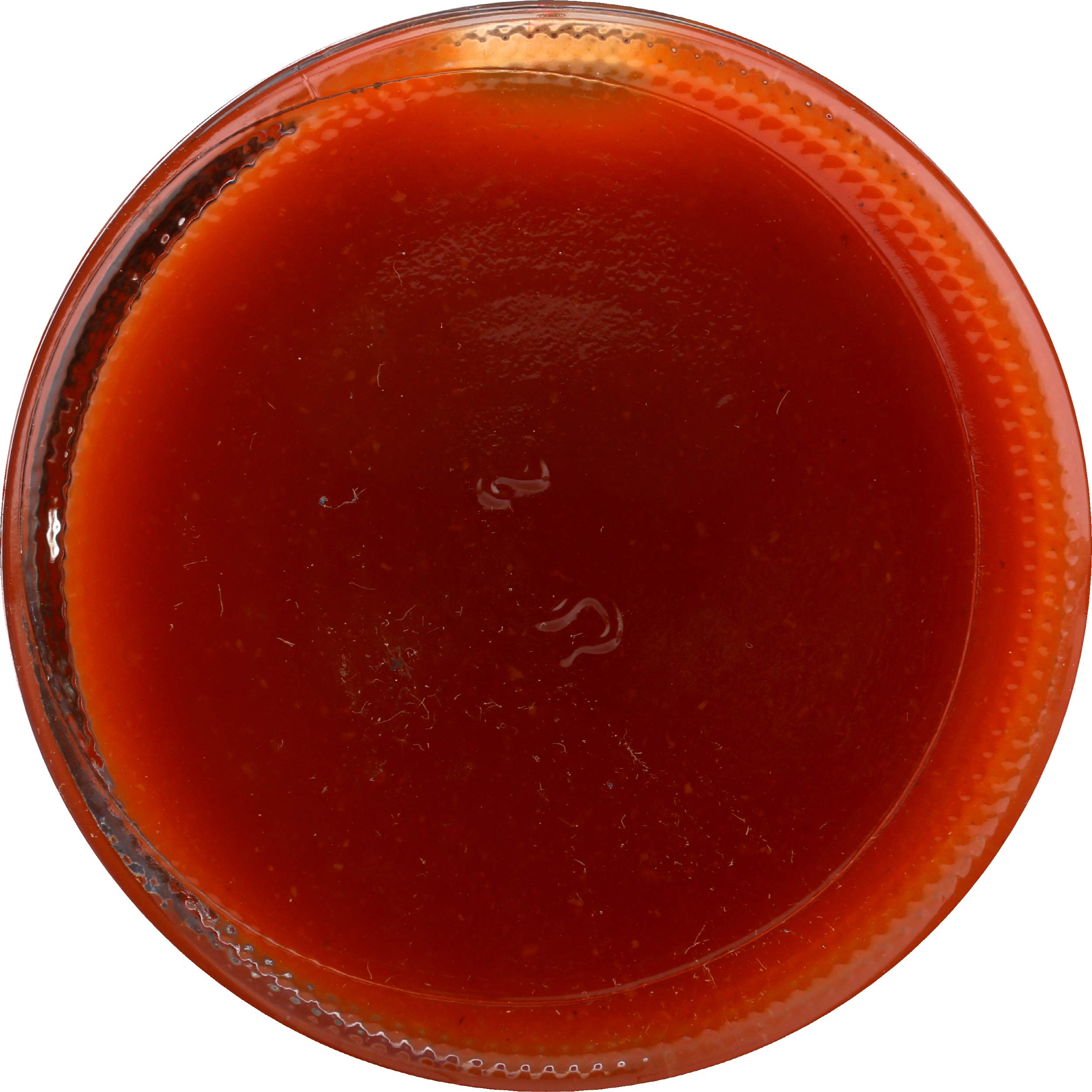 Dramatic drops of Trappey's Red Devil Sauce showing vivid color for dipping
