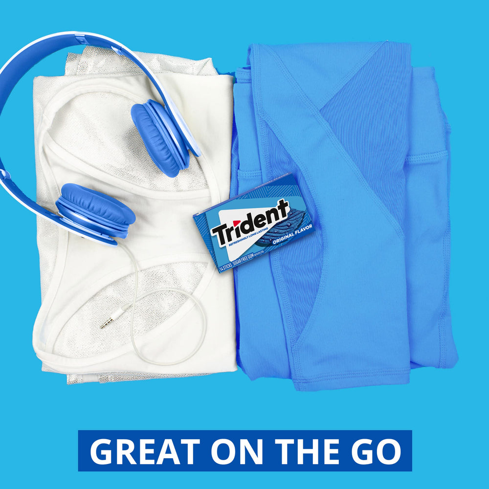 Trident Original gum in a car cup holder for travel.