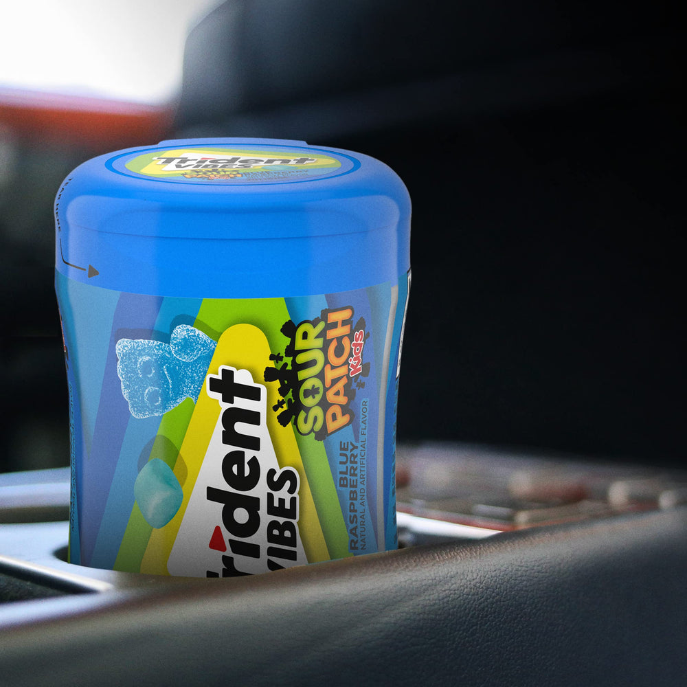 Trident Vibes Blue Raspberry bottle open with gum pieces poured.