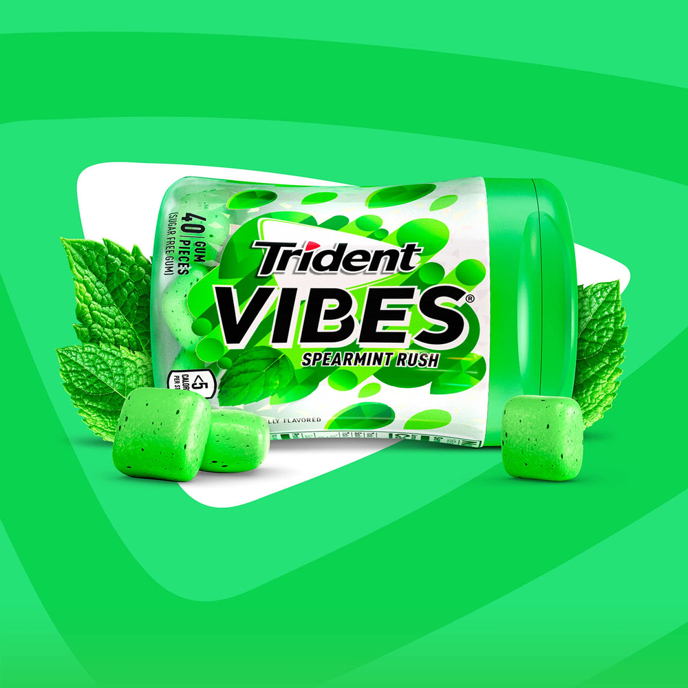 Trident Vibes Spearmint Rush bottle in a car glovebox for freshness.
