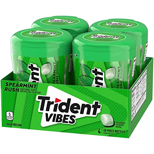 Hands holding Trident Vibes gum for a fresh breath moment.