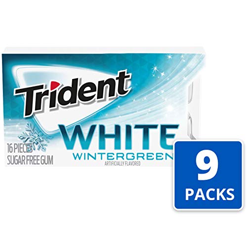Trident White Wintergreen gum in mouth delivering quick refreshing breath after meals.