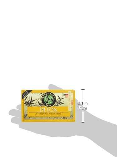 Triple Leaf Detox Tea packets resting on a kitchen counter.