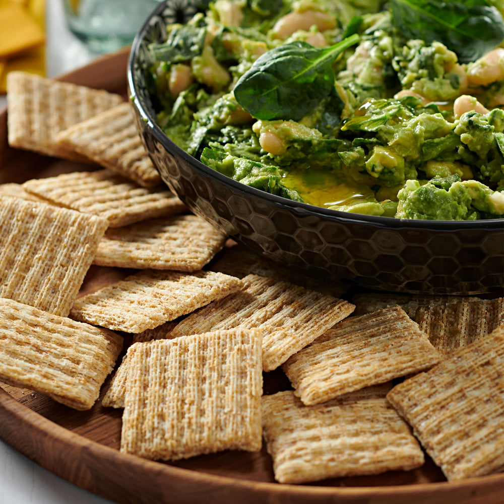 Closeup of crackers highlighting crunchy woven texture.