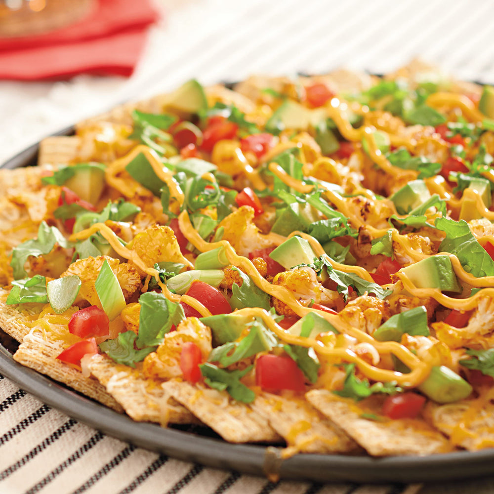 Crisp Triscuit Original crackers with toppings ready to enjoy.