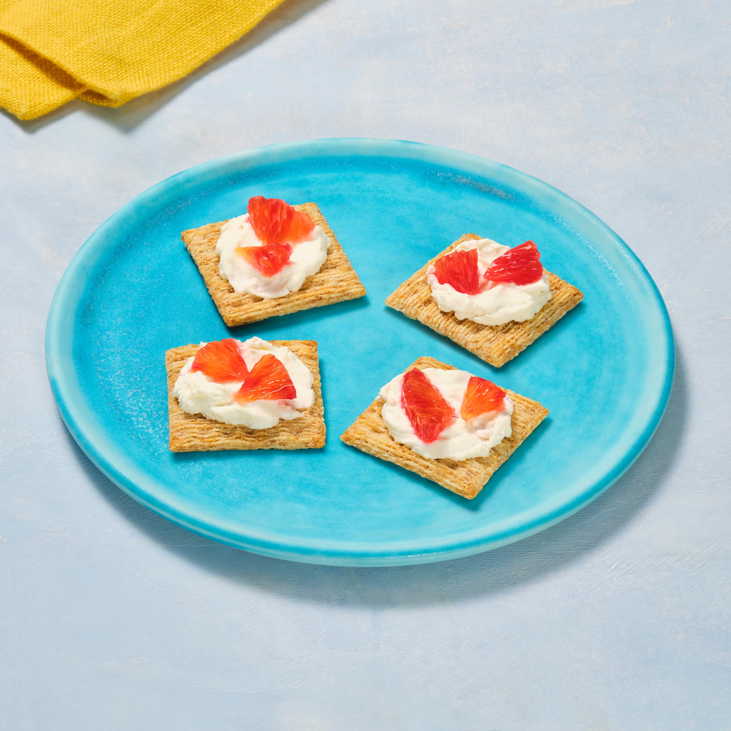 Triscuit Reduced Fat Whole Grain crackers with hummus demonstrates versatile dips for gatherings.