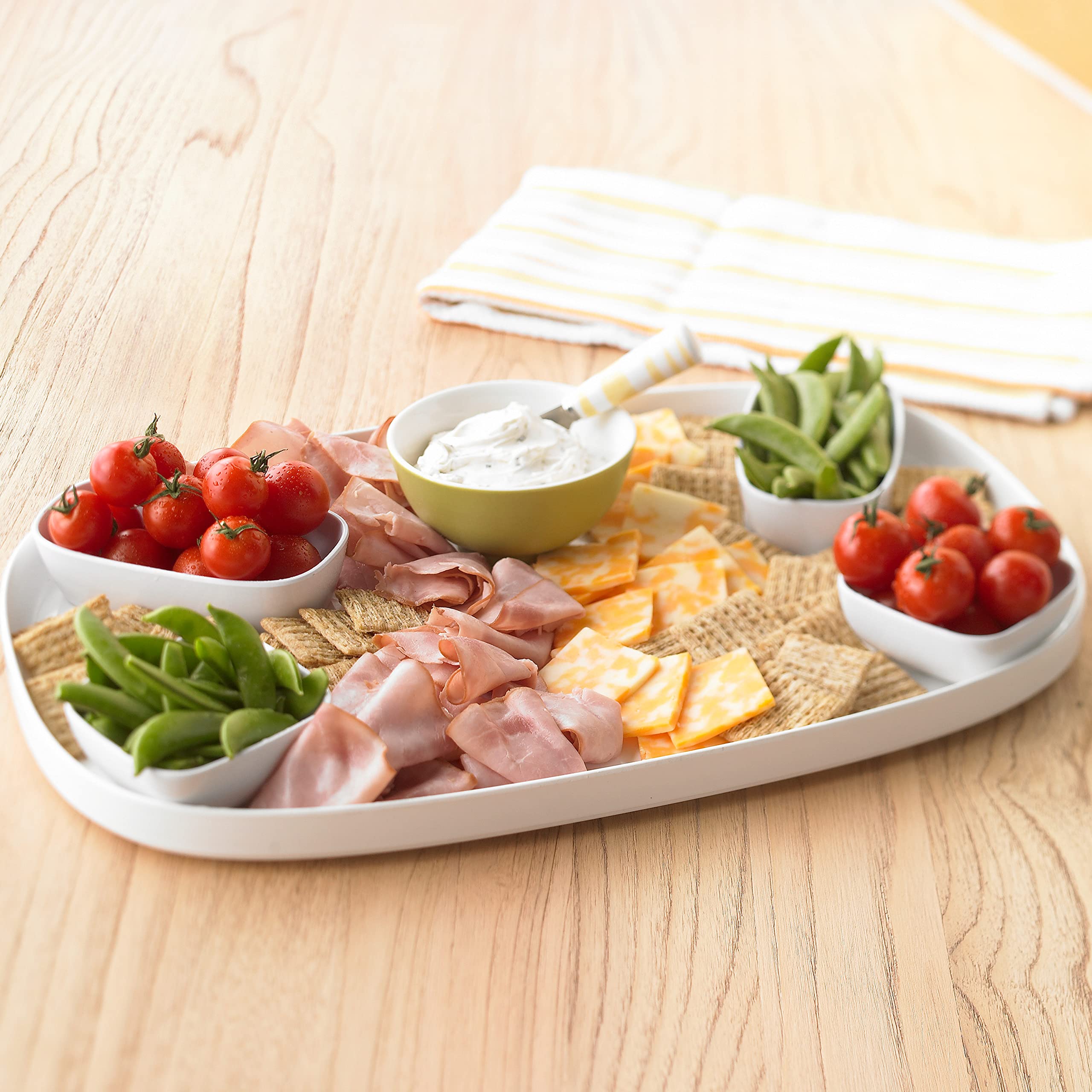 Triscuit Smoked Gouda crackers served with hummus for dipping.