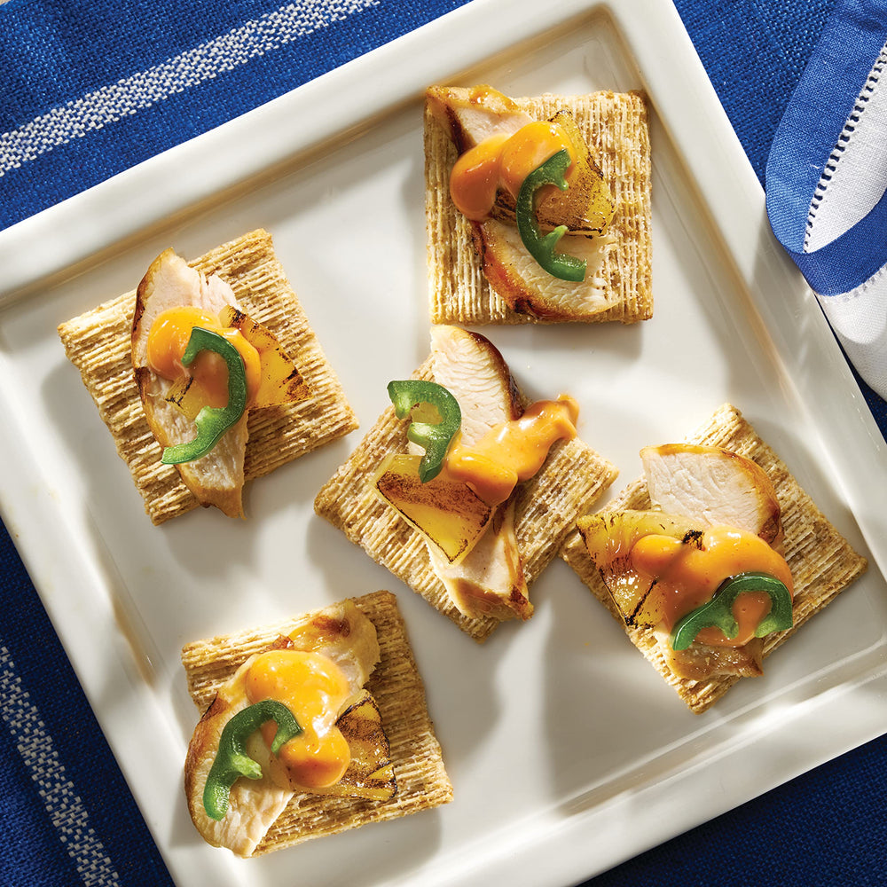 Triscuit Smoked Gouda crackers arranged on a party board.
