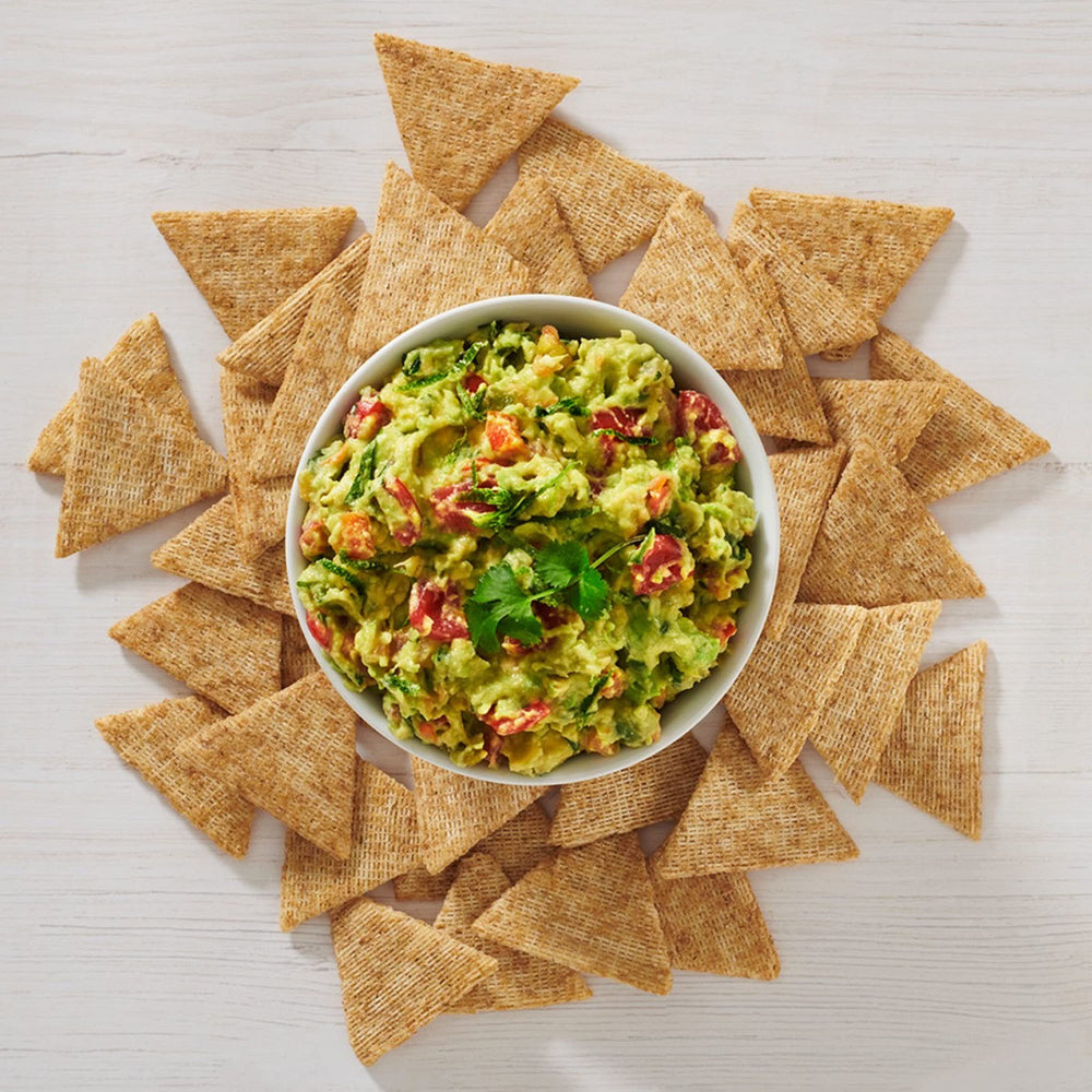 Triscuit Thin Crisps Zesty Jalapeño with hummus dip.