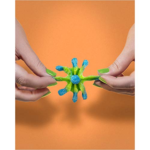 Kids reaching for TROLLI Sour Brite Octopus gummies during movie night.