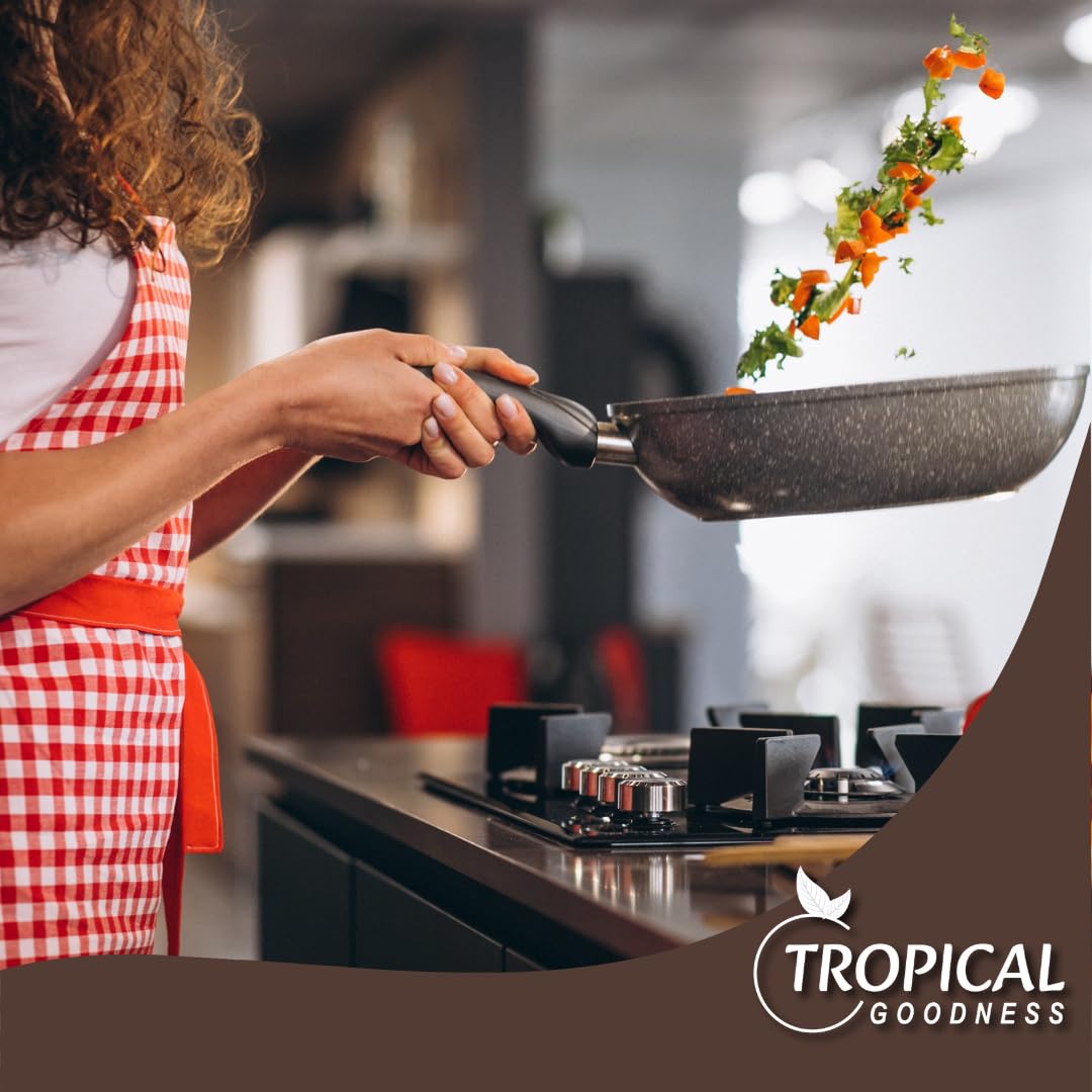 Tropical Goodness pepper powder jar with fresh herbs on kitchen countertop