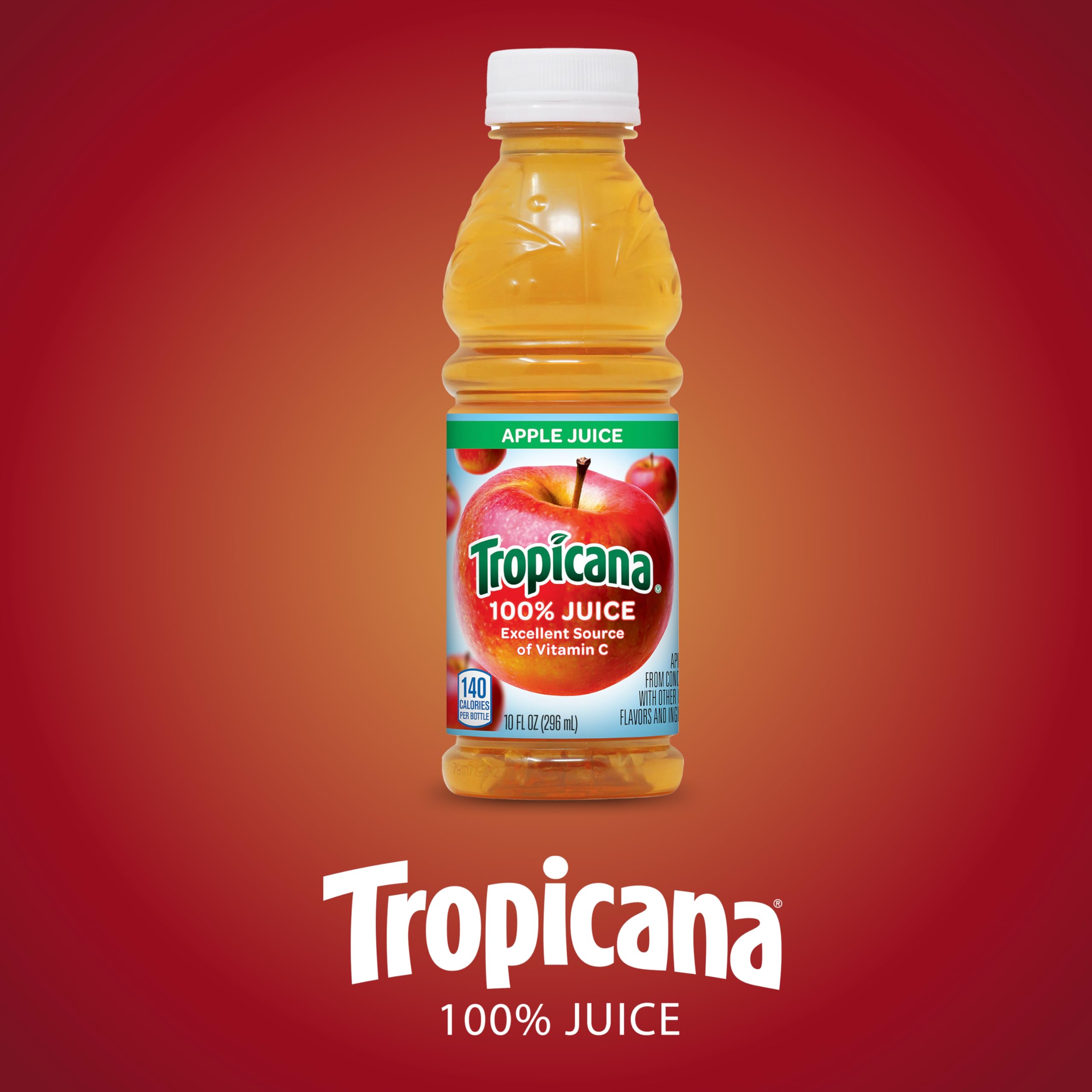 Tropicana Apple Juice 10oz bottle on kitchen counter with family table setting