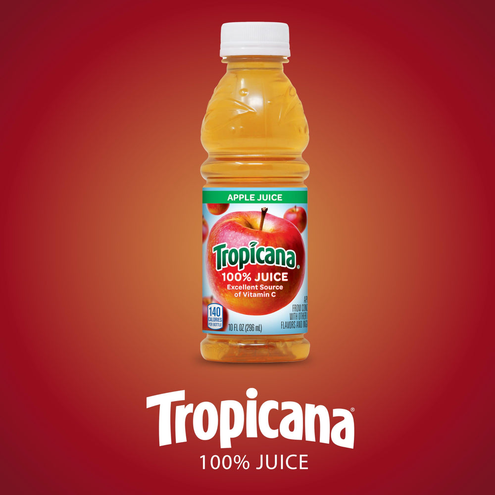 Tropicana Apple Juice 10oz bottle on kitchen counter with family table setting