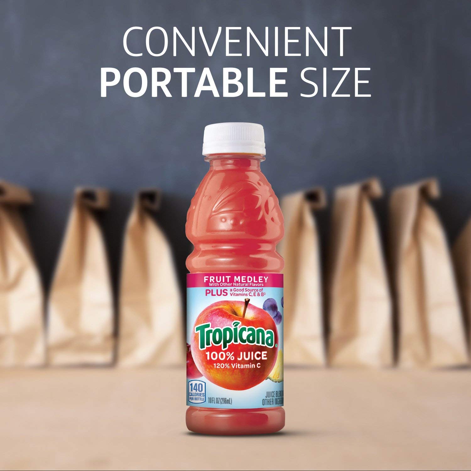 Tropicana Fruit Medley splash in glass highlighting natural color and flavor.