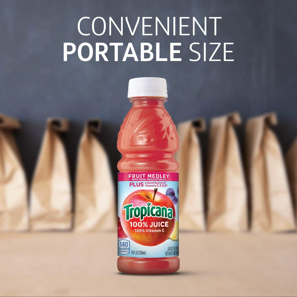 Tropicana Fruit Medley splash in glass highlighting natural color and flavor.