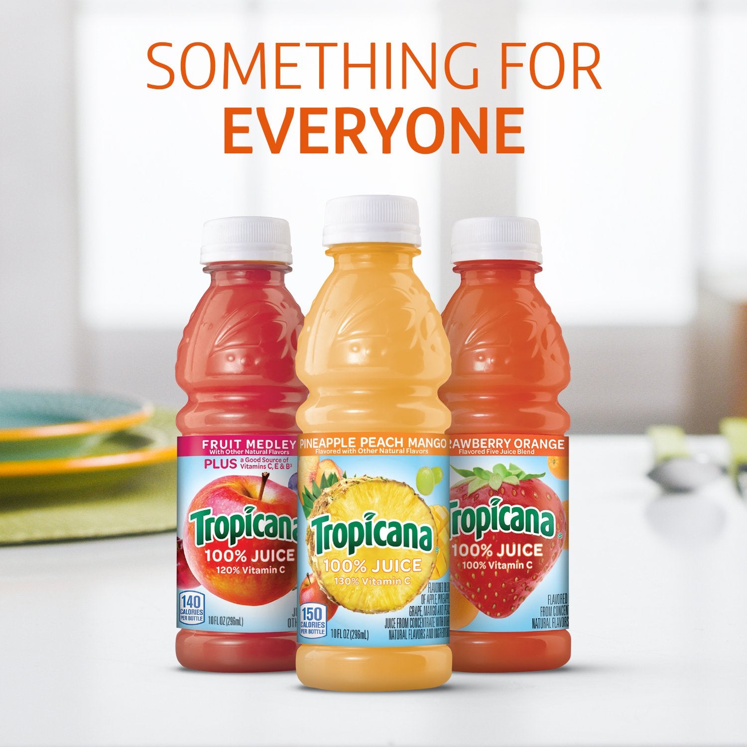 Tropicana Pineapple Peach Mango 10oz bottle pour over ice