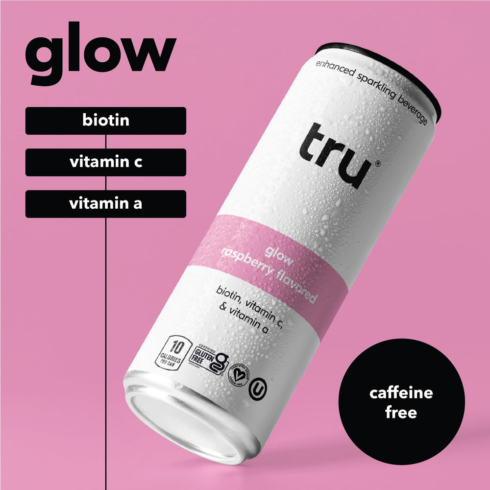 Pouring Tru Glow Seltzer into a glass reveals raspberry color and vitamin C.