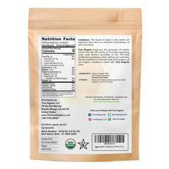 True Organic Cardamom Whole pods closeup reveals fresh aromatic seeds.