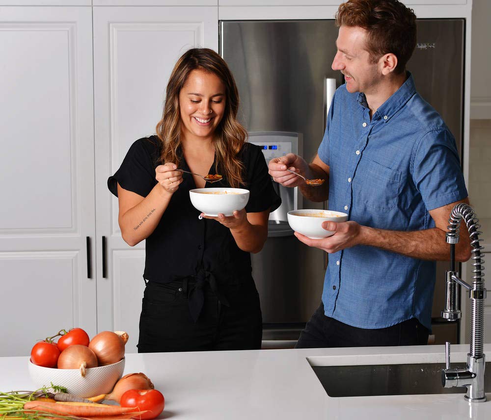 True Primal Roasted Chicken Soup shows garden vegetables in a comforting bowl.