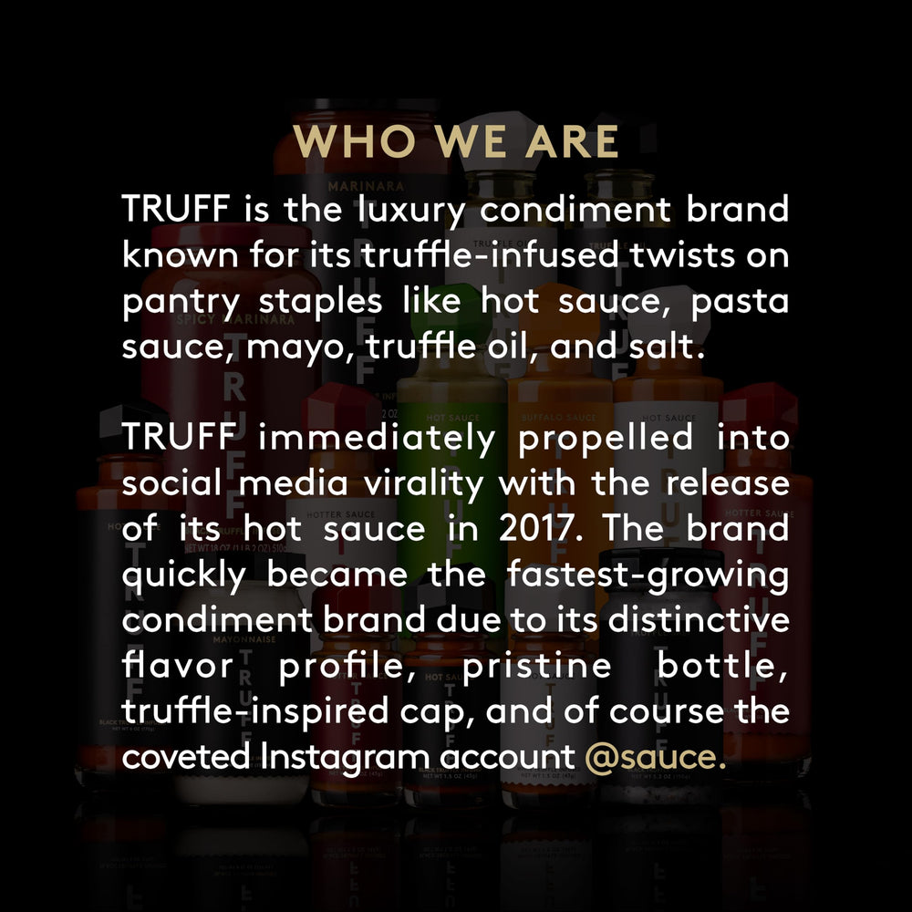 TRUFF Buffalo Sauce jar beside plates, perfect for game-day snacks.