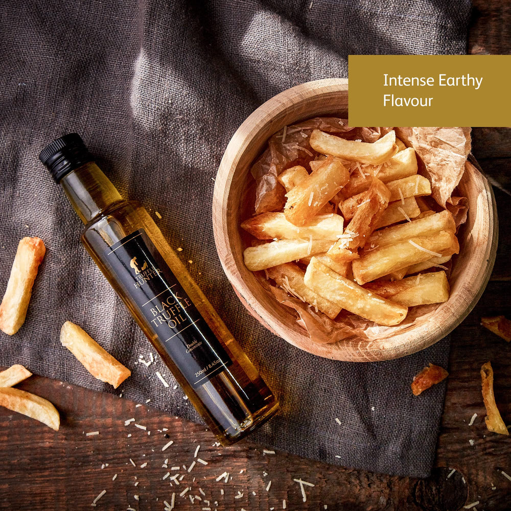 TruffleHunter logo close-up with fresh truffles and oil, signaling premium finishing ingredients.
