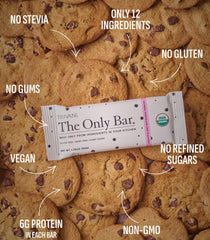 Truvani bar on-the-go in hand for convenient plant-based fueling.