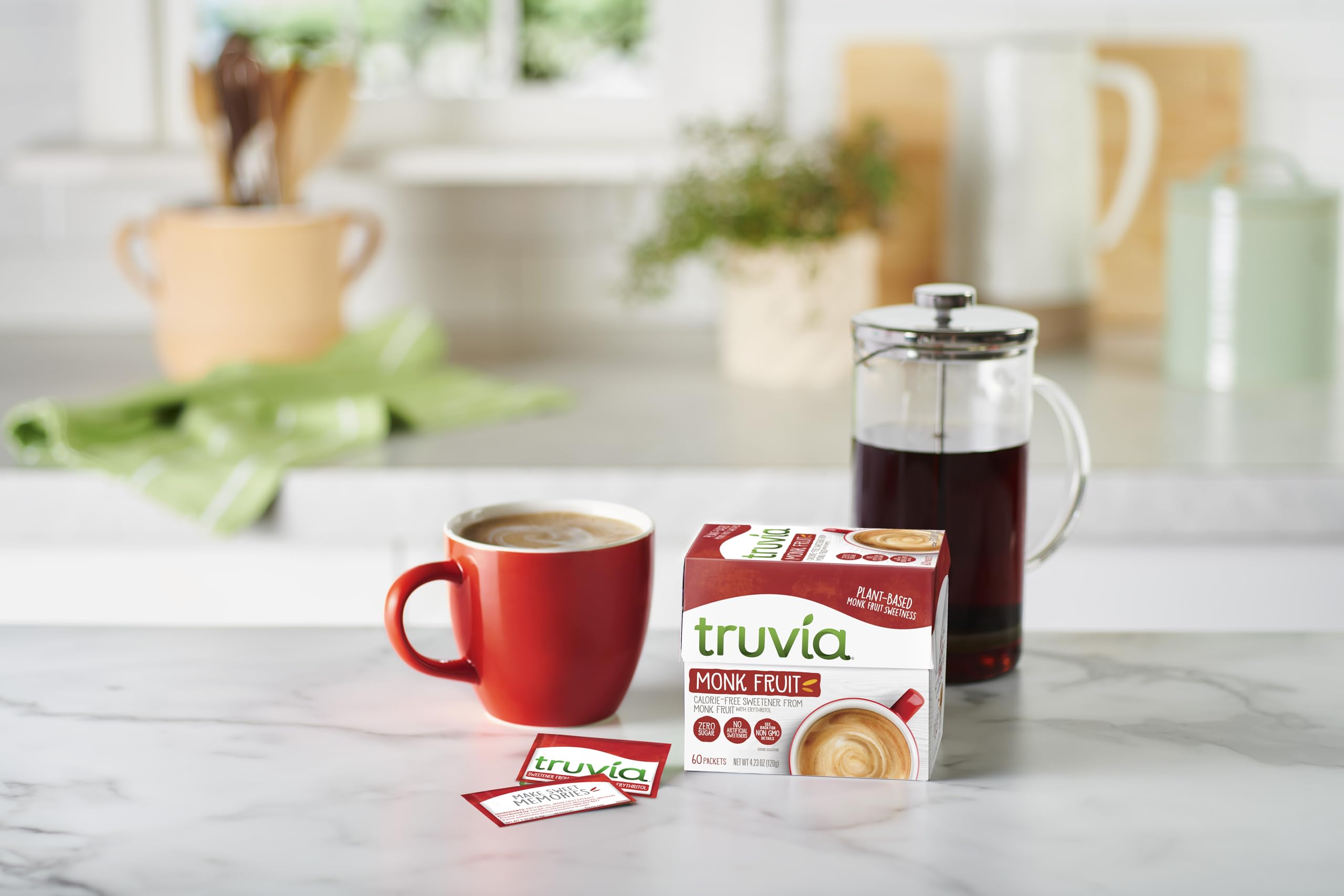 Truvia monkfruit packets near a cocktail glass for a lighter drink
