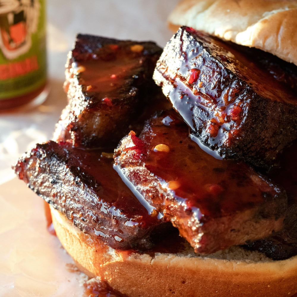 Try Me Tiger Sauce bottle pour capturing glossy heat for meats and seafood