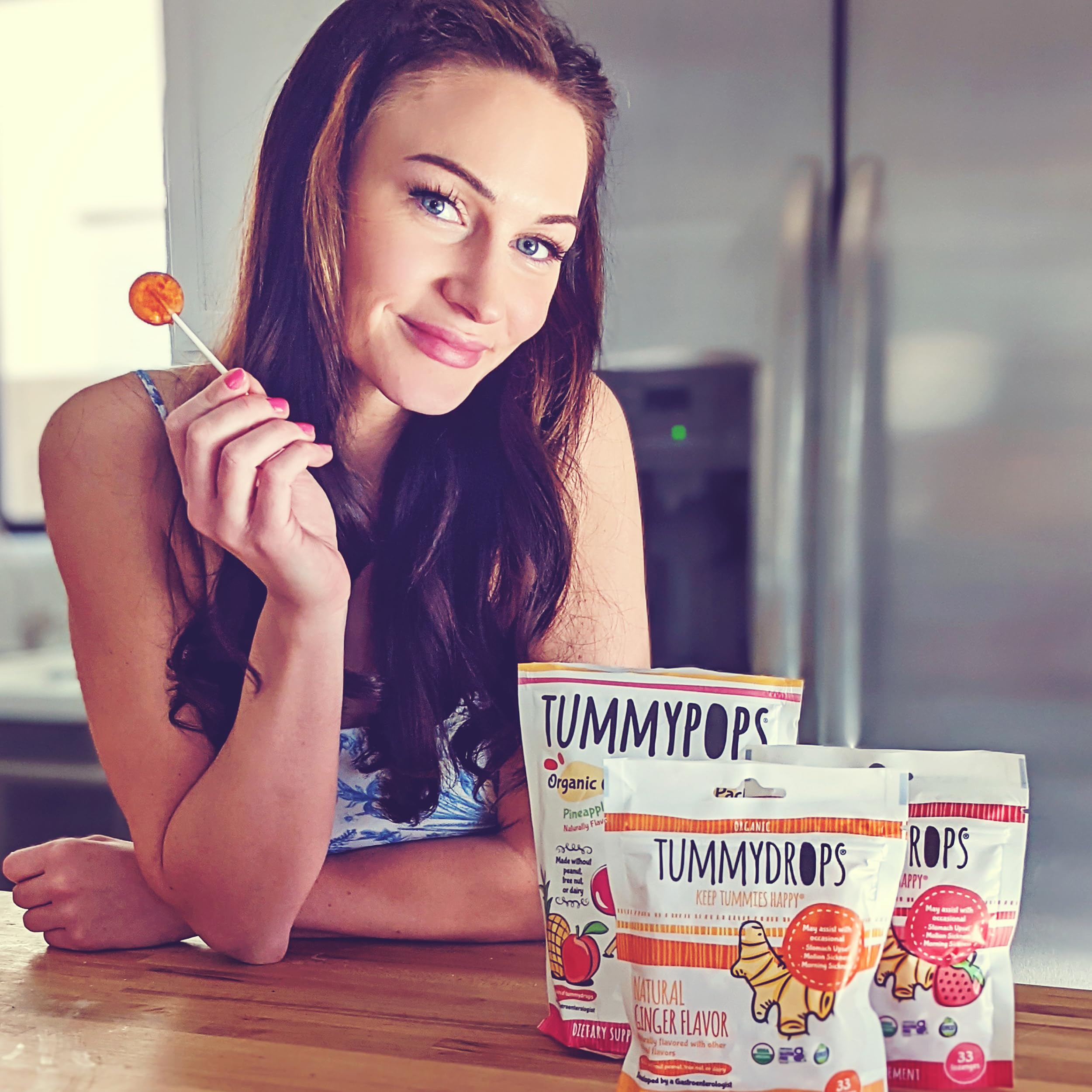 Tummydrops lozenges in hand demonstrate convenient on-the-go digestion support
