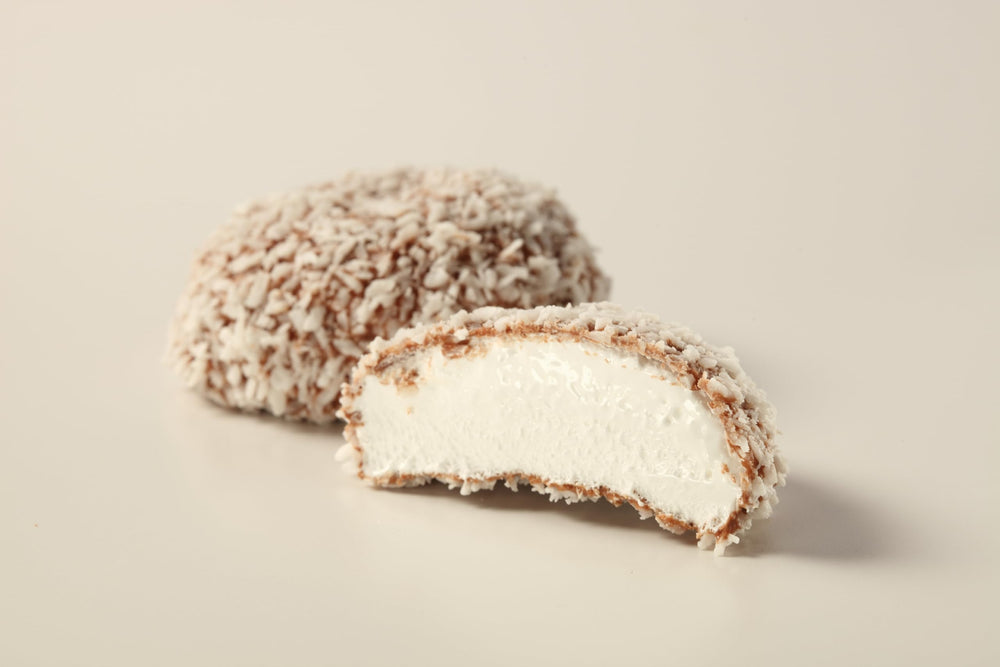 Tunnock's Snowballs serving-plate image suggests a cozy, indulgent treat.