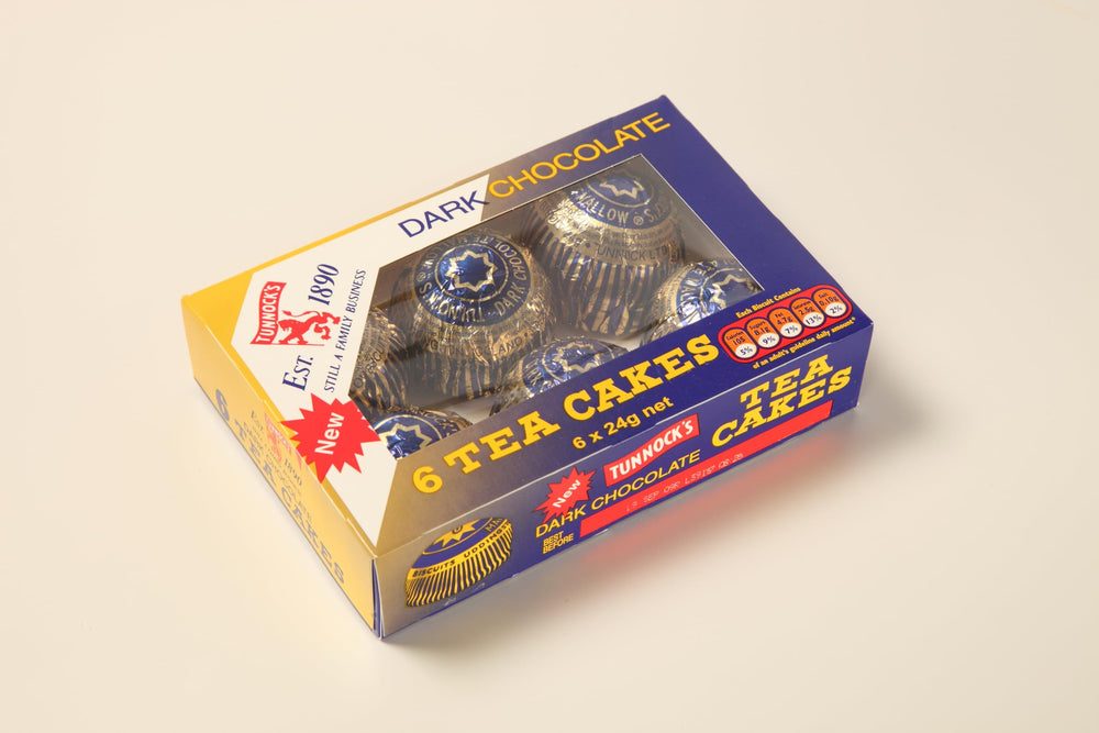 Tunnock's Tea Cakes marshmallow close-up, showcasing fluffy center and glossy coating.
