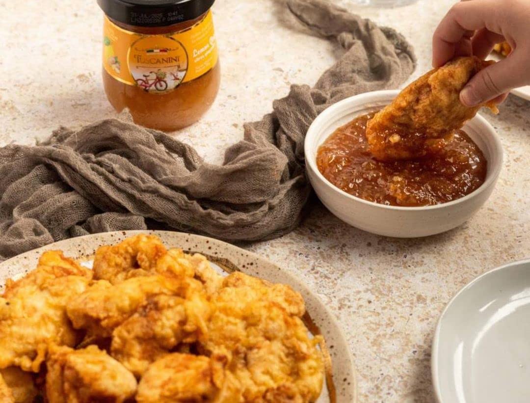 Tuscanini apricot preserves label closeup, highlighting natural ingredients and quality.