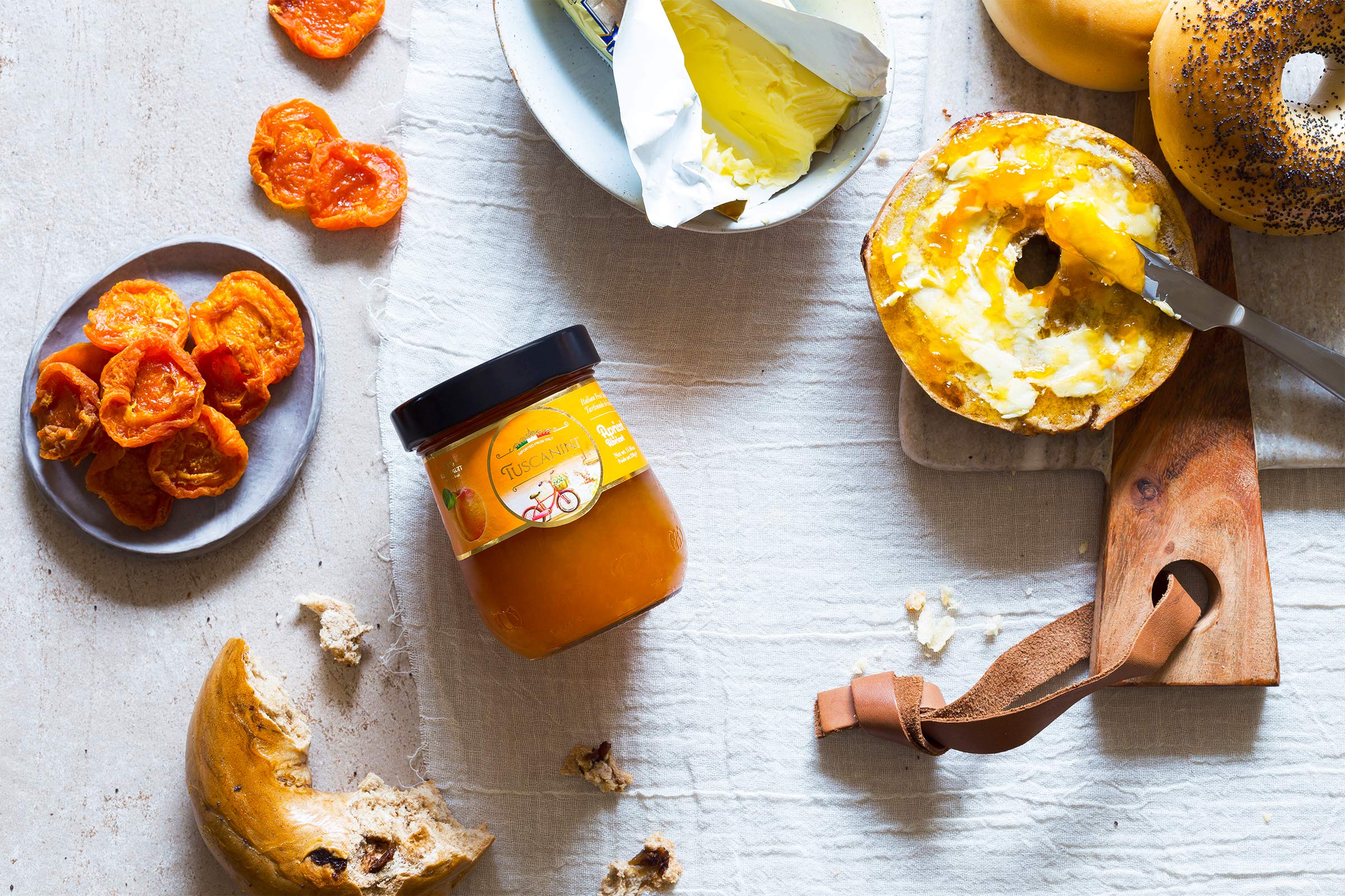 Tuscanini apricot preserves jar side angle, showcasing smooth texture and glass jar.