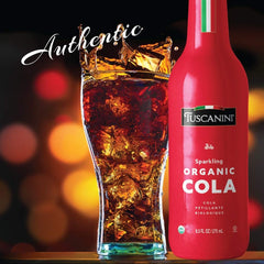 Pouring Tuscanini Organic Cola into a glass, refreshing aroma rises