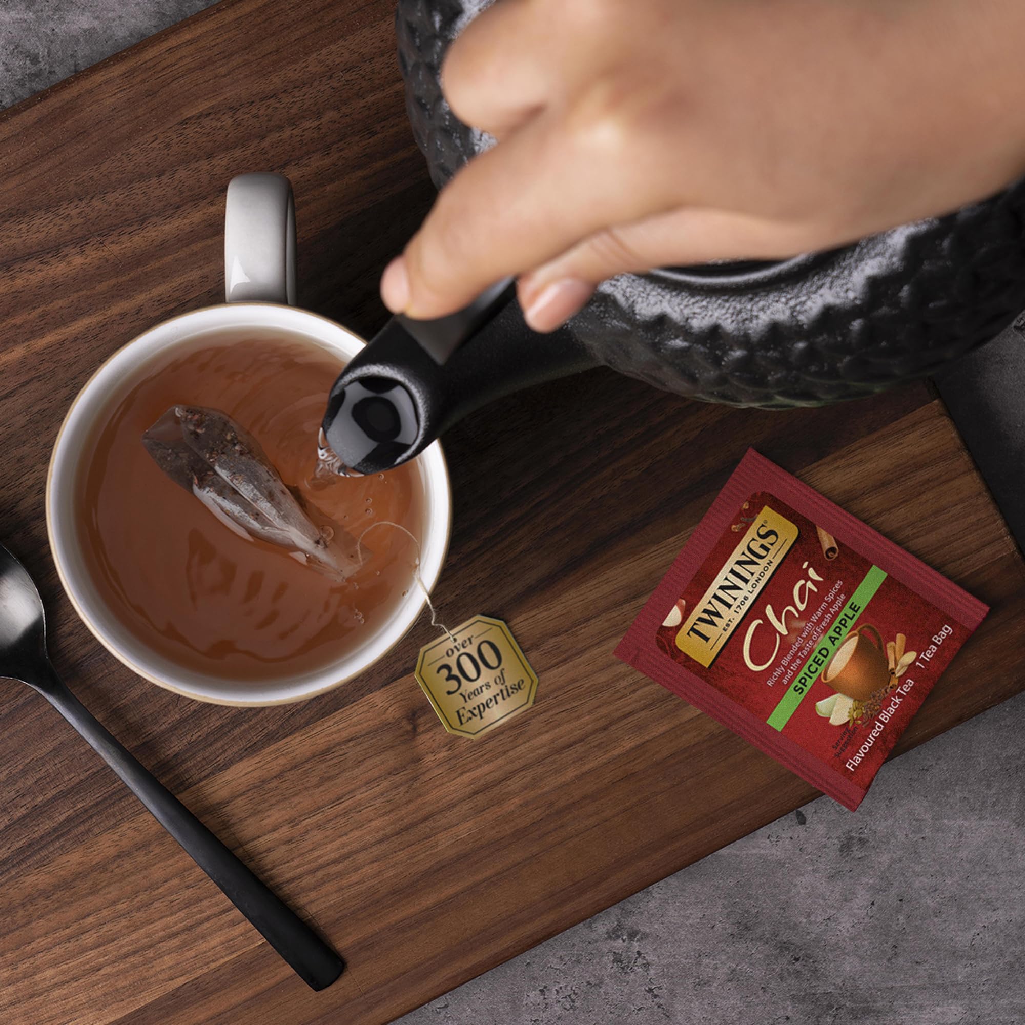 Steaming cup of Twinings Chai tea inviting cozy breaks.