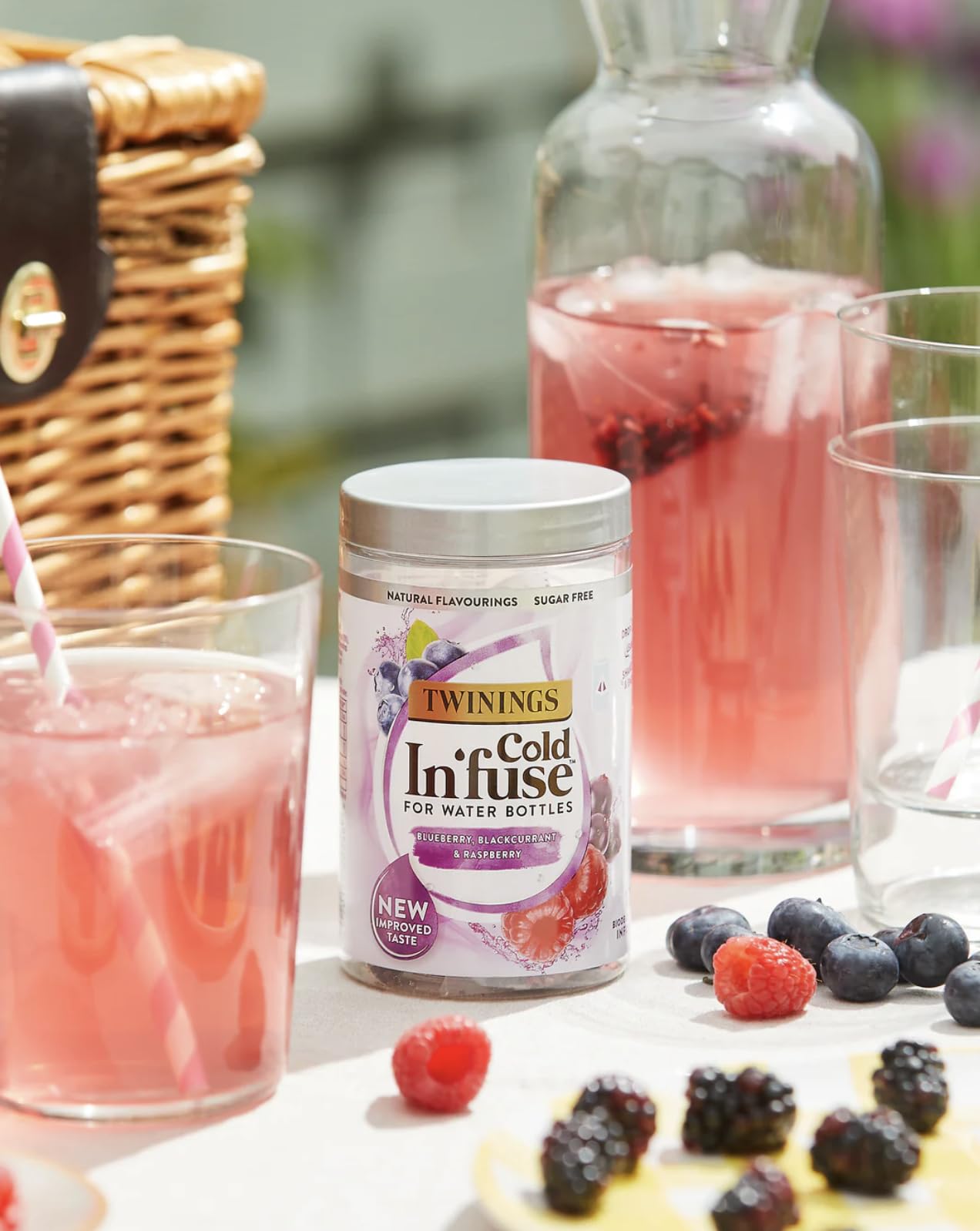 Glass of Twinings Cold Infuse iced tea with vibrant berry color.