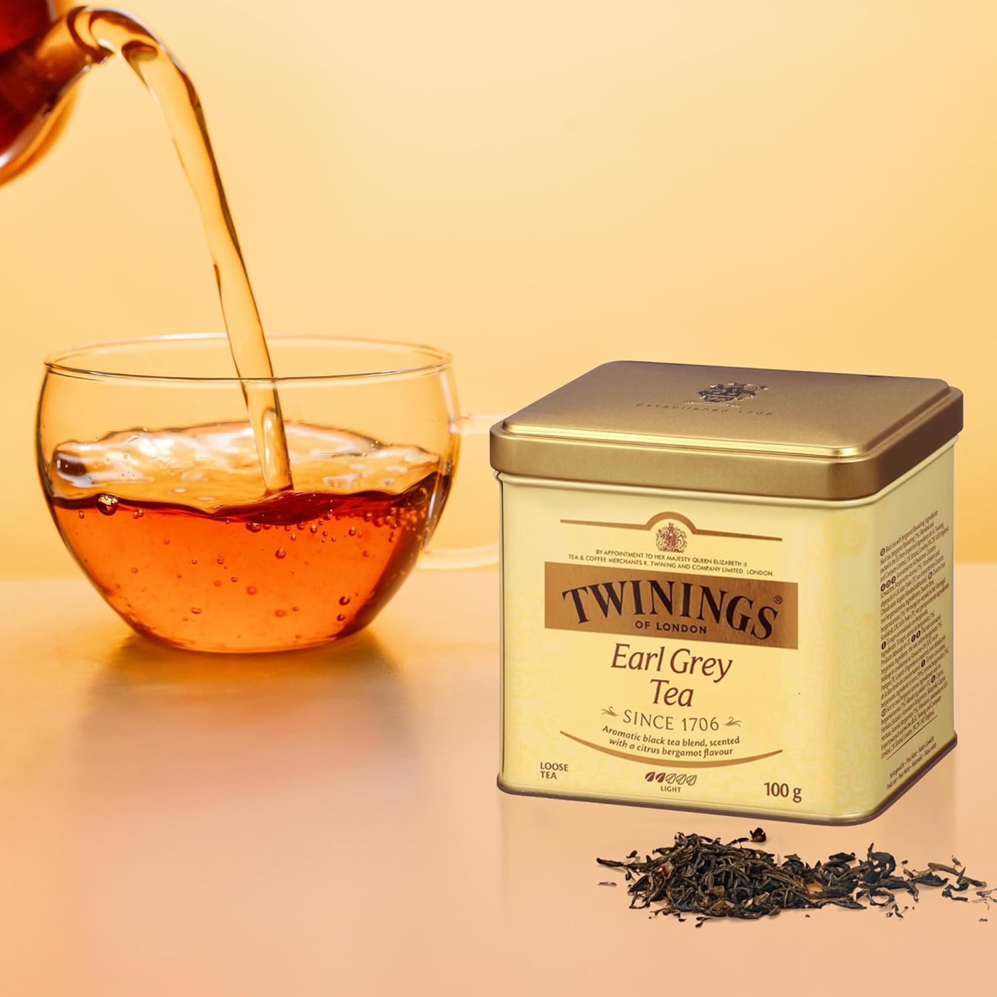 Twinings Earl Grey loose tea leaves steeping in a cup for energizing flavor