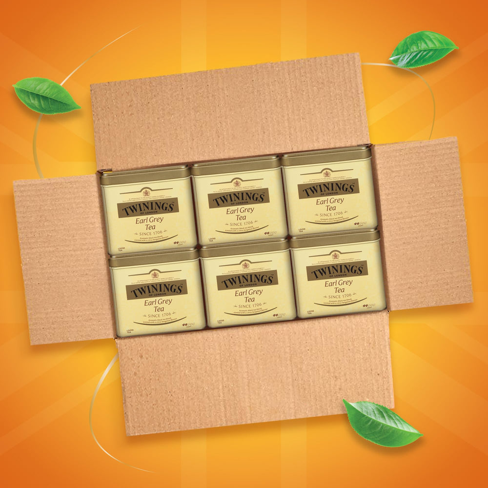 Twinings Earl Grey tea leaves steeping in hot water releasing citrus notes
