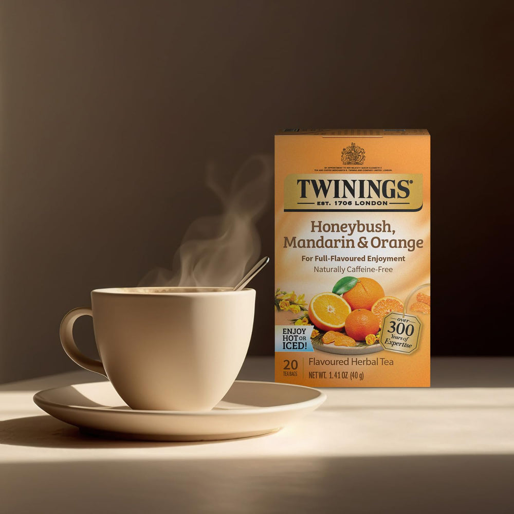 Twinings Honeybush Mandarin Orange tea cup, cozy moment with caffeine-free, refreshing flavor.