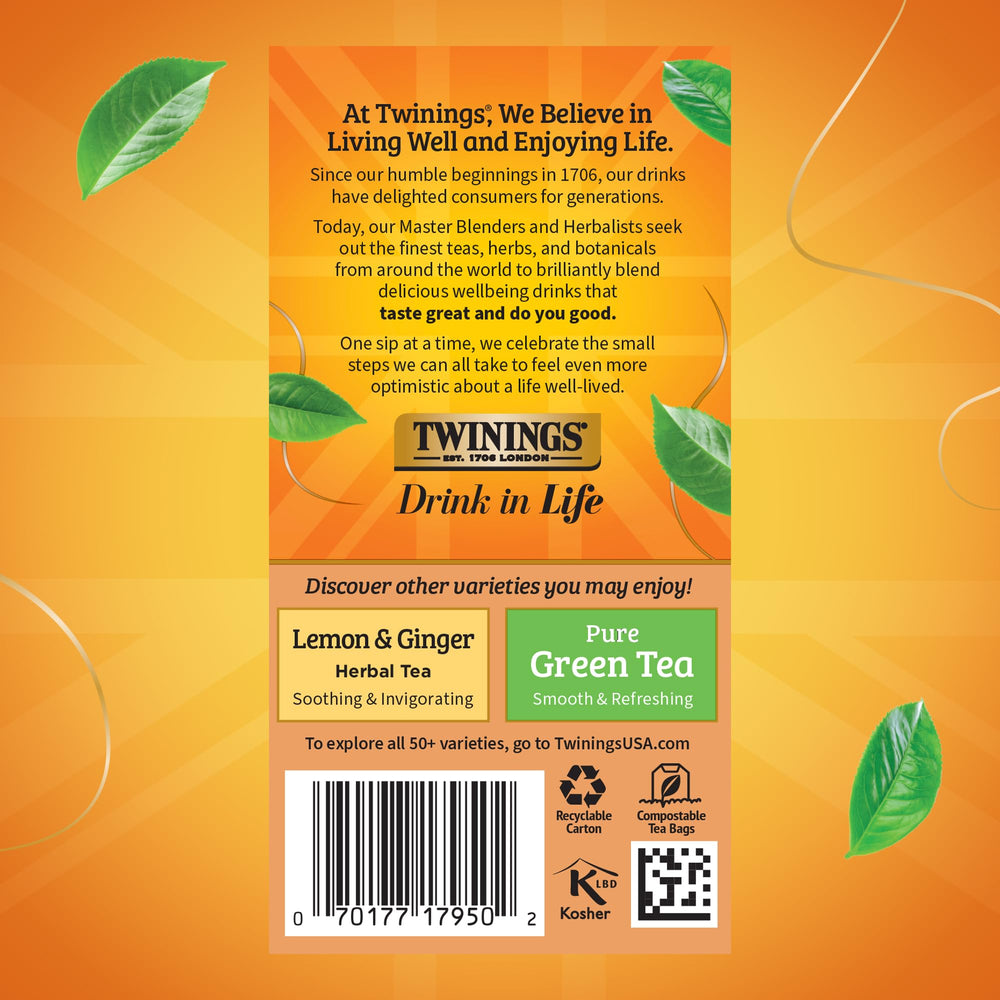 Fresh orange peels and cinnamon sticks beside Twinings tea setup