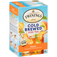 Glass of peach iced tea with slices signaling refreshment.