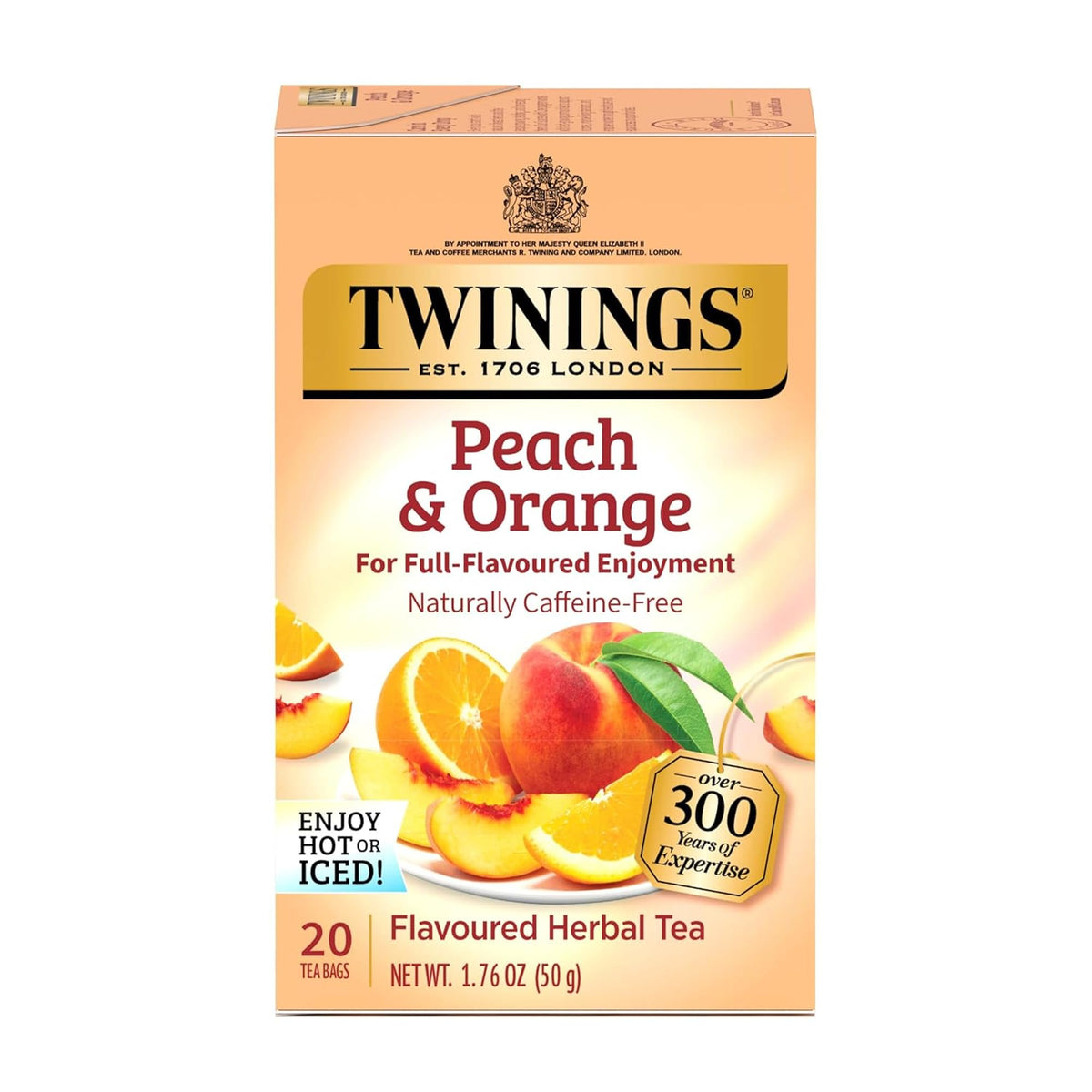 Twinings peach-orange herbal tea bags on a counter; caffeine-free, inviting aroma.