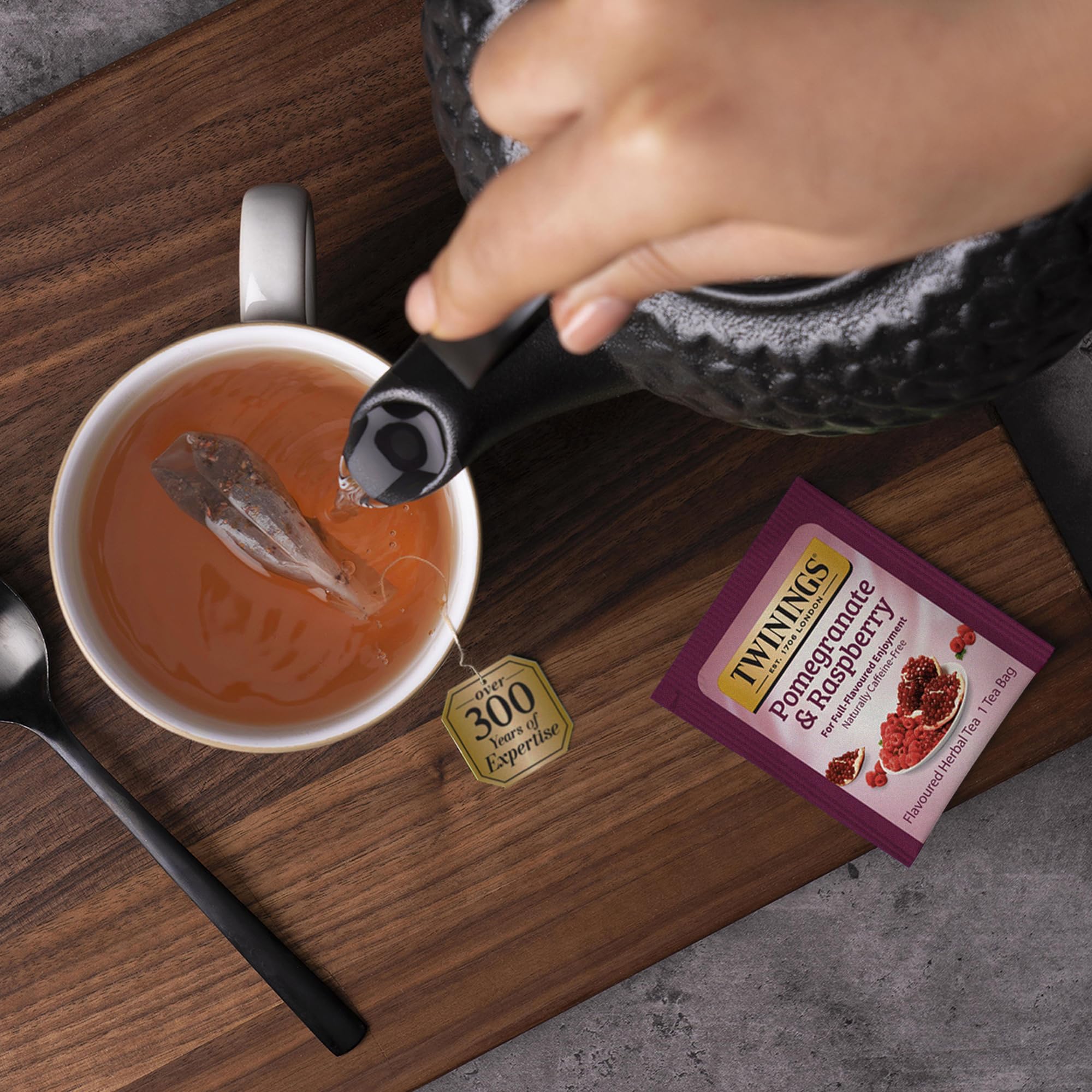 Aromatic steam from Twinings herbal blend with hibiscus notes.
