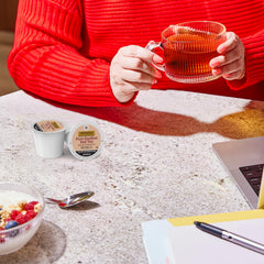 Twinings Rooibos K-Cup pods in a Keurig brewer delivering a caffeine-free, comforting cup.