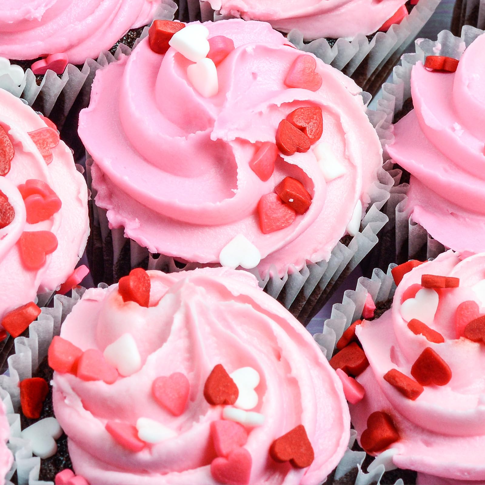 Twisweet mini heart sprinkles on ice cream for playful dessert accent.