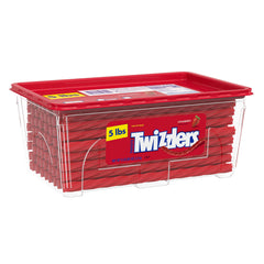Twizzlers Twists Strawberry strands dipped into milk, playful snack idea.