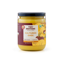 Two Brothers India Farms A2 Ghee bottle pour enhances cooking with rich, nutty flavor.