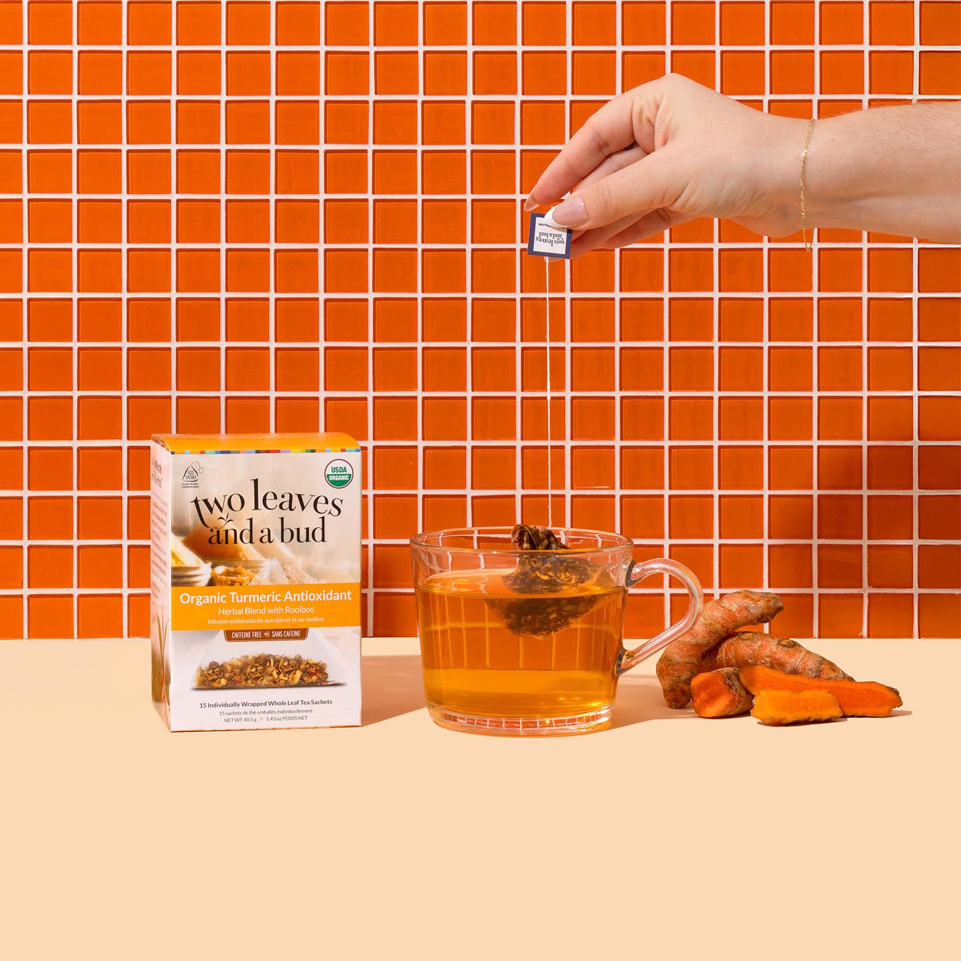 Two Leaves and a Bud turmeric tea sachets closeup, pyramid sachets for fuller infusion.