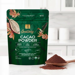 Pouring U Chocolate Organic Cacao Powder into a bowl, showcasing smooth texture.