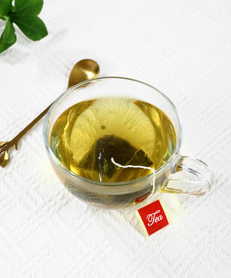 ULTHMOK moringa tea bag in cup steeping, showcasing mild aroma.